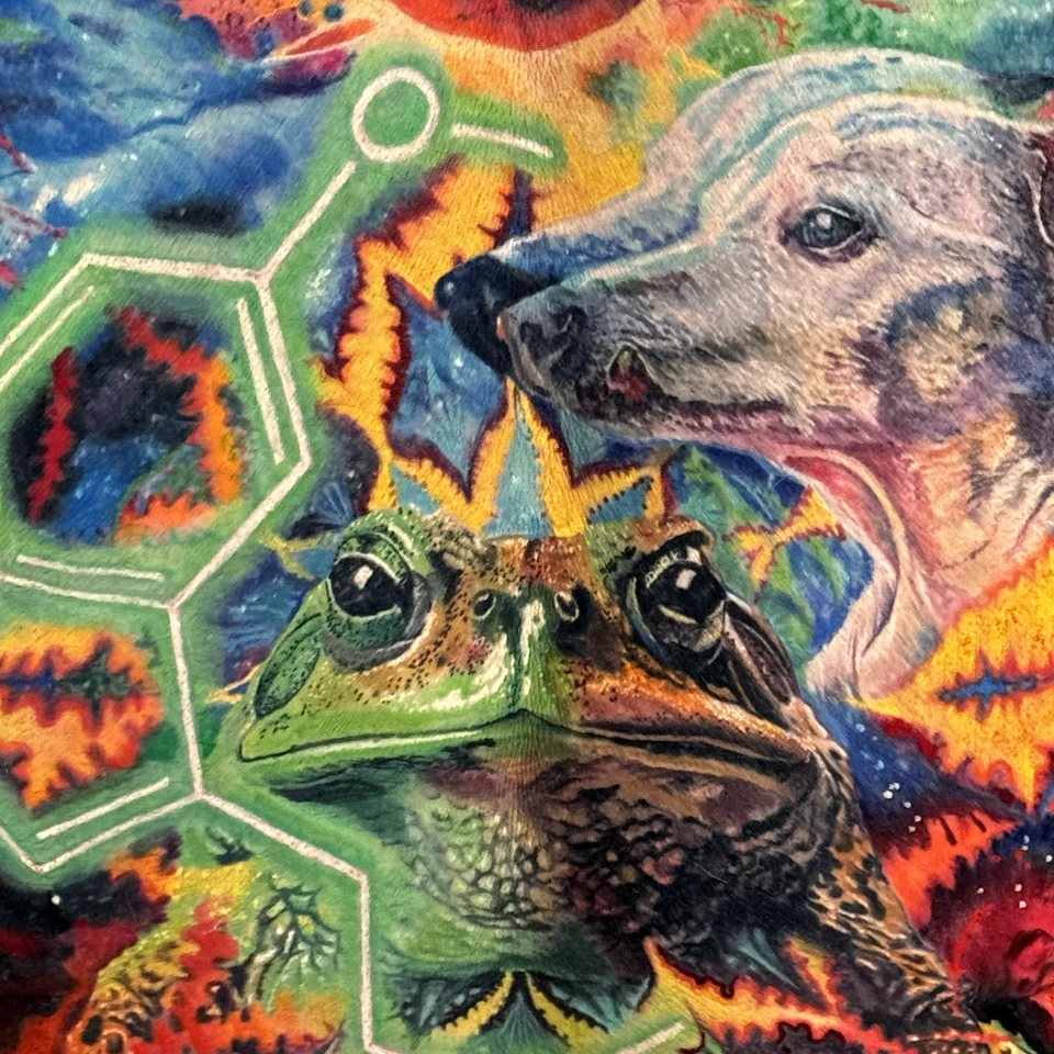 A large back piece combining animals and an imagined natural world