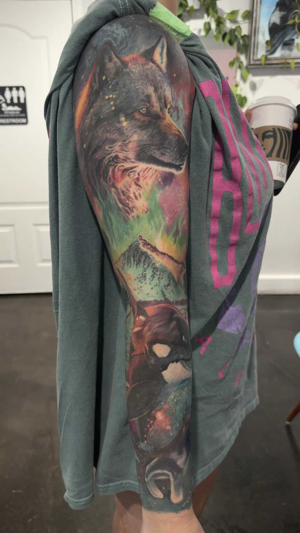 Wildlife sleeve by Johnny Andres: a wolf, mountains and an orca